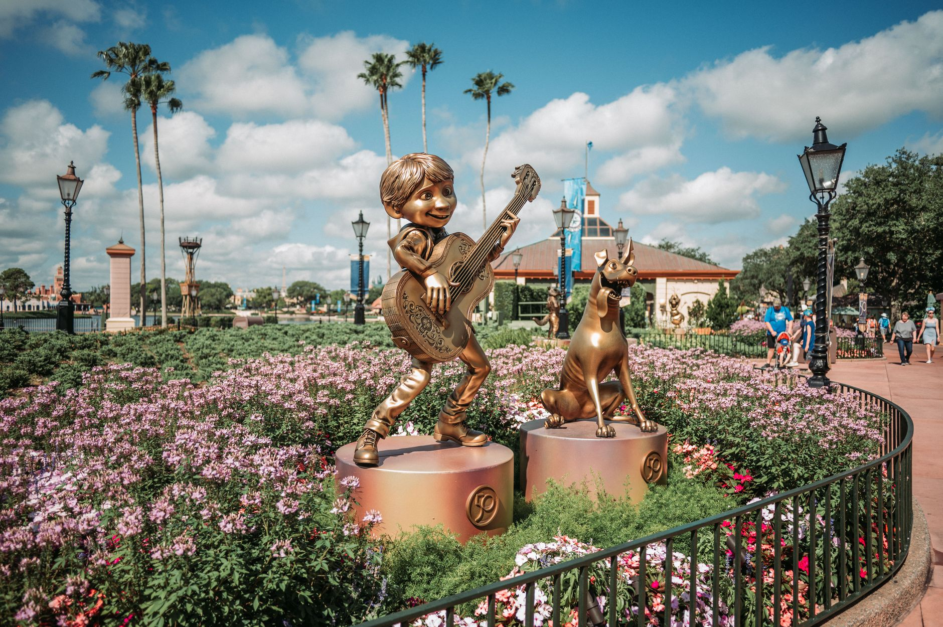flowerbed and statues in the disney world